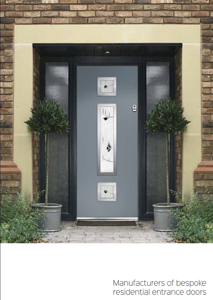 Grey composite entrance door with decorative glass panels, installed with side lights and brick surround
