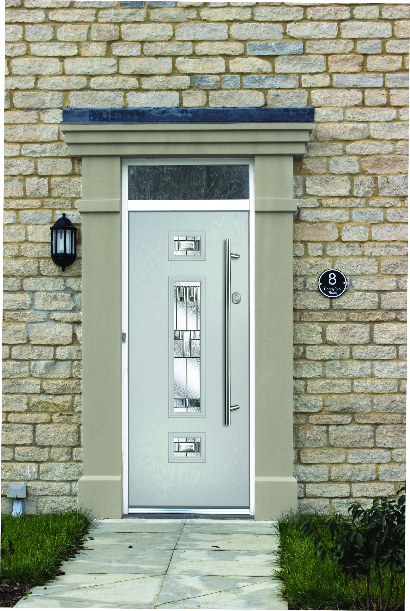 Grey Galactic Neptune Composite door on a brickwork house.
